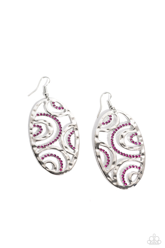 Hammered silver bars and ribbons of dazzling pink rhinestones curve and ripple into an abstract circular design, creating a dazing dazzle. Earring attaches to a standard fishhook fitting.  Sold as one pair of earrings.