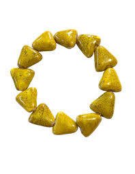 Painted in a distressed Mustard finish, ceramic beads shaped like shark teeth are threaded along a stretchy band around the wrist for a seasonal flair.

Sold as one individual bracelet.