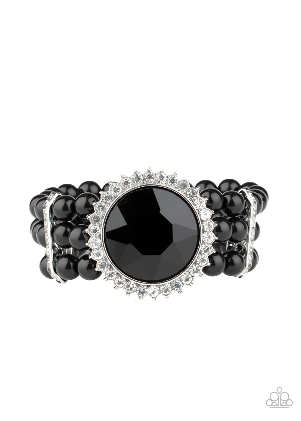 Threaded along stretchy bands, strands of polished black beads are held in place with white rhinestone encrusted fittings around the wrist. Bedazzled in a ring of glassy white rhinestones, a dramatically oversized black gem adorns the center for a speechless finish.  Sold as one individual bracelet.