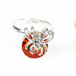 Kid's orange spider ring with hemitite rhinestones down front