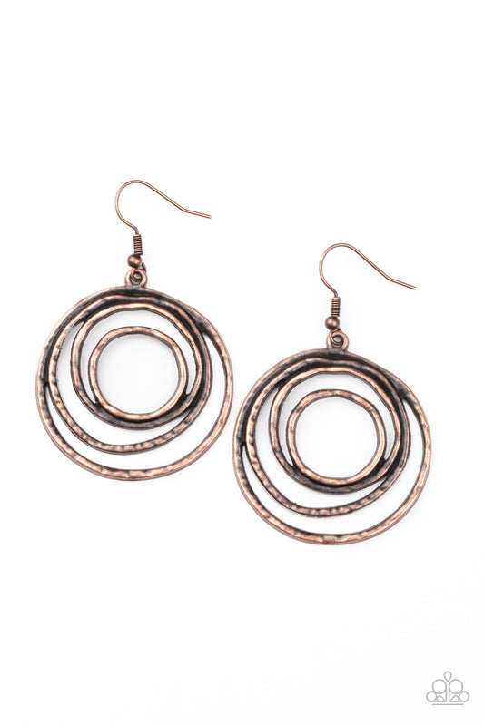 Brushed in an antiqued shimmer, hammered copper wire coils into a dizzying frame for an edgy industrial look. Earring attaches to a standard fishhook fitting.

Sold as one pair of earrings.
