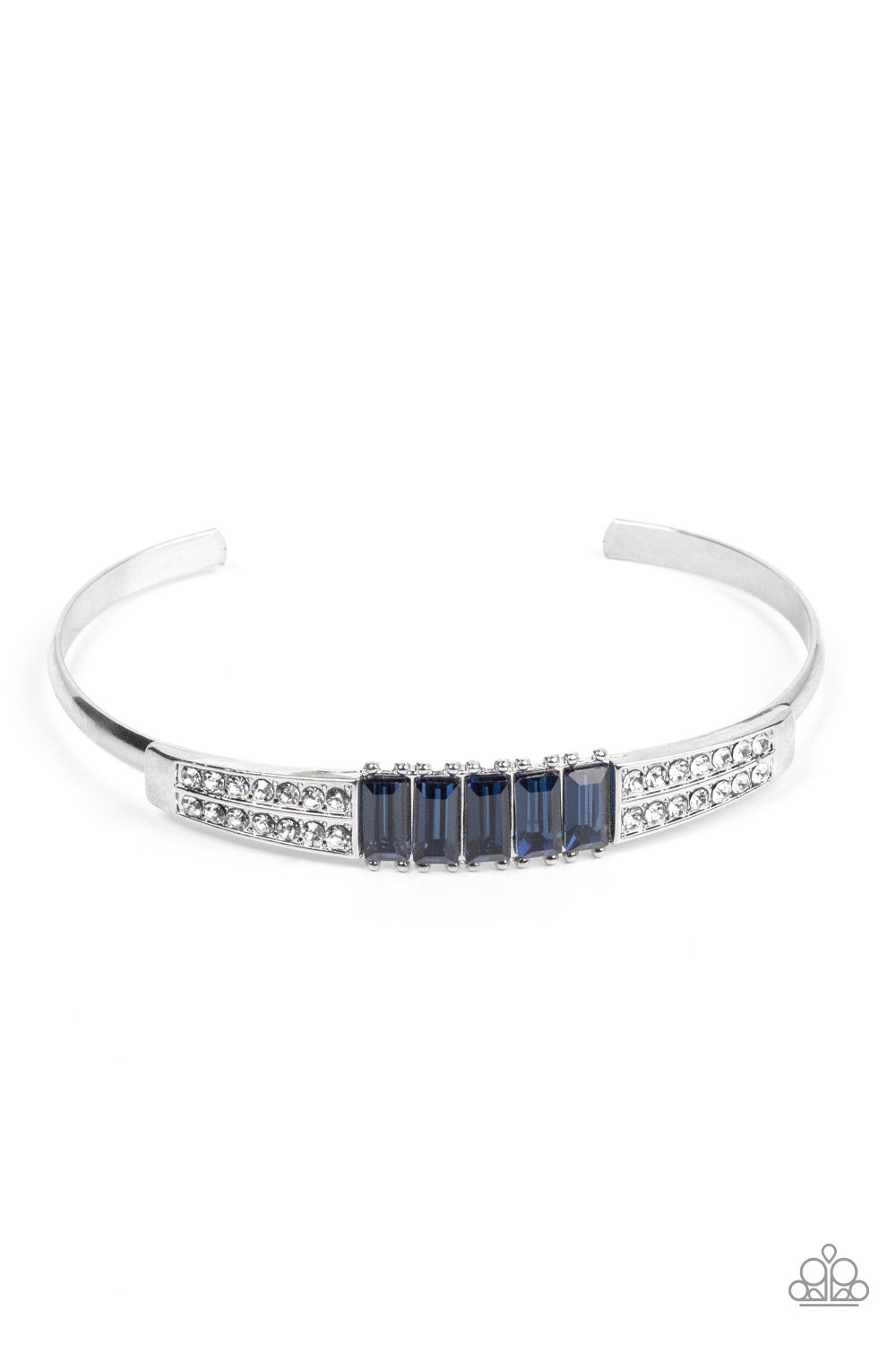 Flanked by stacked frames of glassy white rhinestones, a radiant row of emerald cut blue rhinestones adorn the center of a dainty silver cuff for a glitzy fashion.  Sold as one individual bracelet.