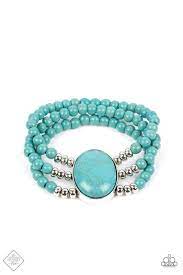 Layers of turquoise beads are threaded along stretchy bands that connect to a stunning oval turquoise stone, creating an extraordinary statement piece around the wrist.  Sold as one individual bracelet.