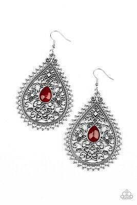 A glowing red cat's eye stone is pressed into the center of an antiqued silver teardrop swirling with floral filigree and dainty white rhinestones. Earring attaches to a standard fishhook fitting.  Sold as one pair of earrings.