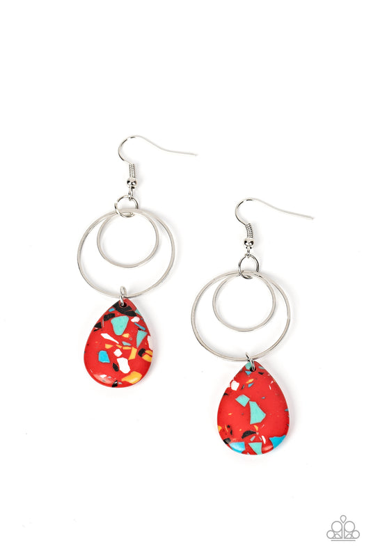 Featuring a modern terrazzo finish, a speckled red stone teardrop glides along the bottom of two dainty hoops that delicately link into a dizzying lure. As the stone elements in this piece are natural, some color variation is normal. Earring attaches to a standard fishhook fitting.  Sold as one pair of earrings.