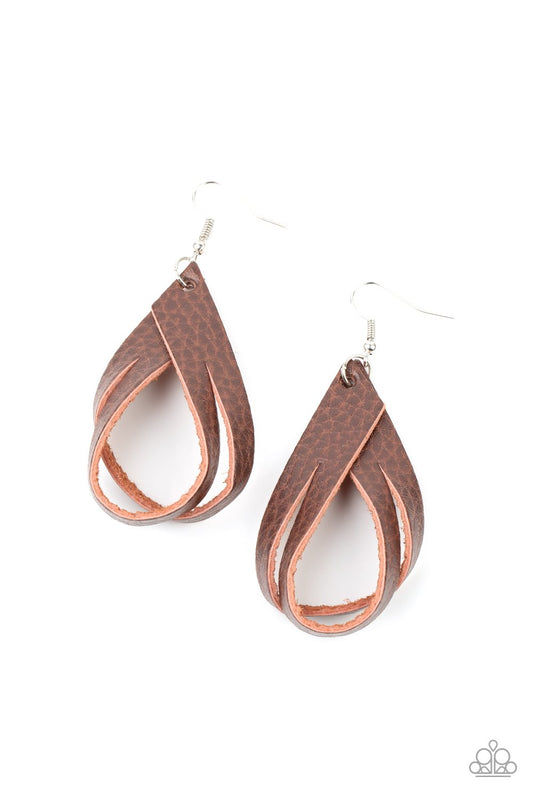 A piece of rustic brown leather is spliced into strands that delicately loop into an earthy frame. Earring attaches to a standard fishhook fitting.  Sold as one pair of earrings.