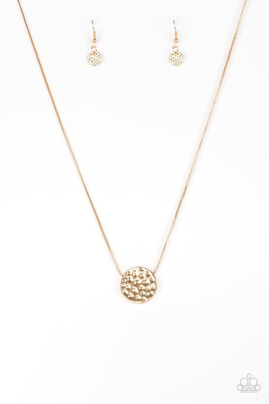 Delicately hammered in shimmery detail, a glistening gold pendant slides along a dainty gold box-chain below the collar for a bold look. Features an adjustable clasp closure.  Sold as one individual necklace. Includes one pair of matching earrings.