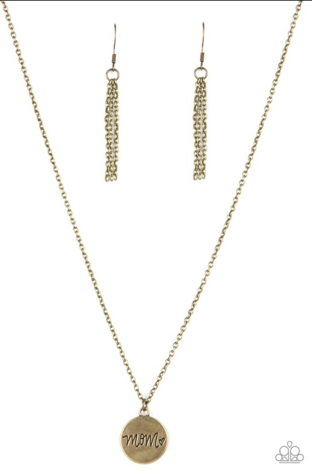 A dainty heart engraved next to the word "Mom" on a brass disc creates a sweet memento as it falls below the collar. Features an adjustable clasp closure.  Sold as one individual necklace. Includes one pair of brass fringe earrings.