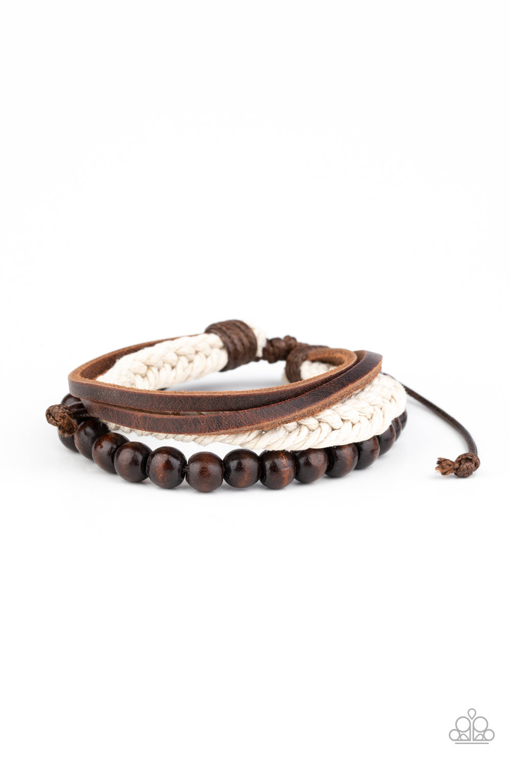 Mismatched strands of wooden beads, leather bands, and braided twine layer across the wrist for an earthy look. Features an adjustable sliding knot closure.  Sold as one individual bracelet.